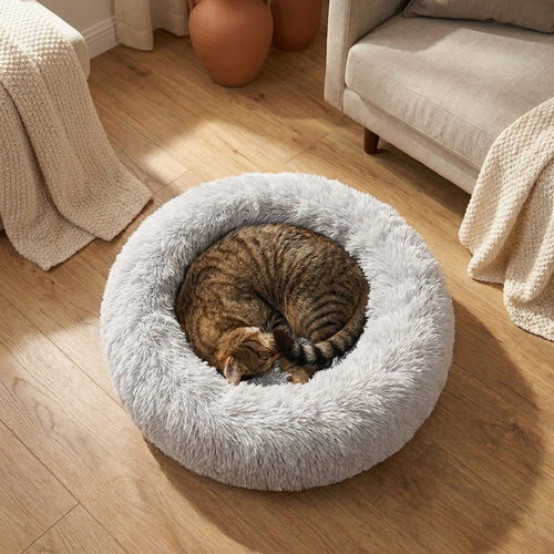 The Cloud Loaf Bed overhead view, tabby curled croissant-style with tail over nose